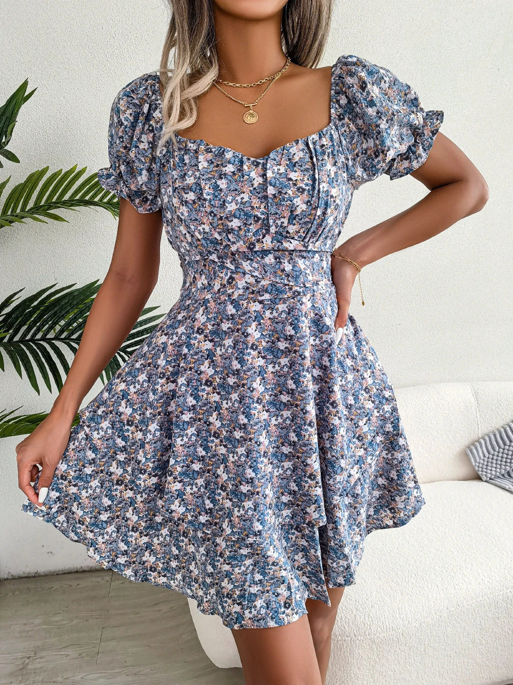Stylish floral mini dress with A-line silhouette, high waist, and ruffled hem in various vibrant colors