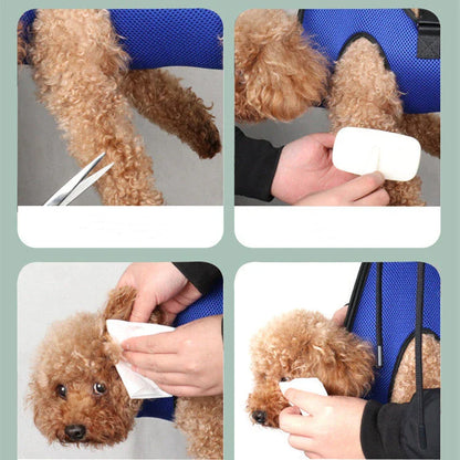 Adjustable pet grooming hammock with straps, buckles, comb, and nail clipper for convenient nail trimming and bathing of cats and dogs