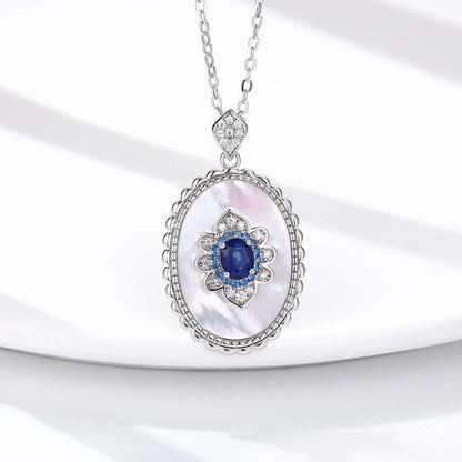 Elegant sterling silver pendant necklace with sparkling sapphires and diamonds, perfect for fashion-forward women