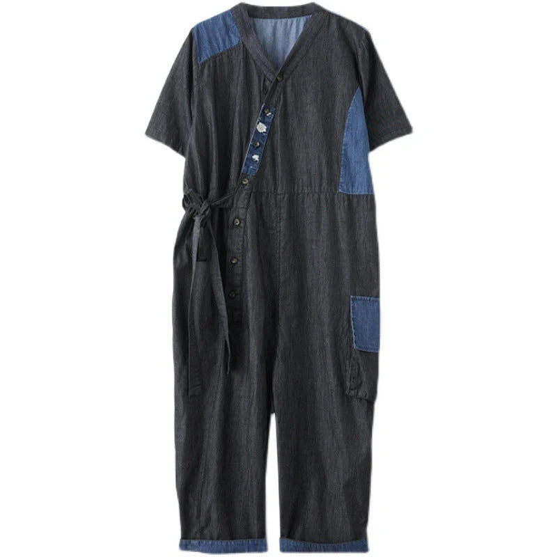 Women's denim drawstring jumpsuit with wide legs and cropped length, available in blue and black colours