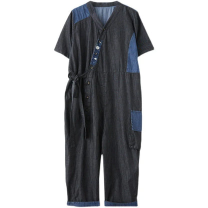 Women's denim drawstring jumpsuit with wide legs and cropped length, available in blue and black colours