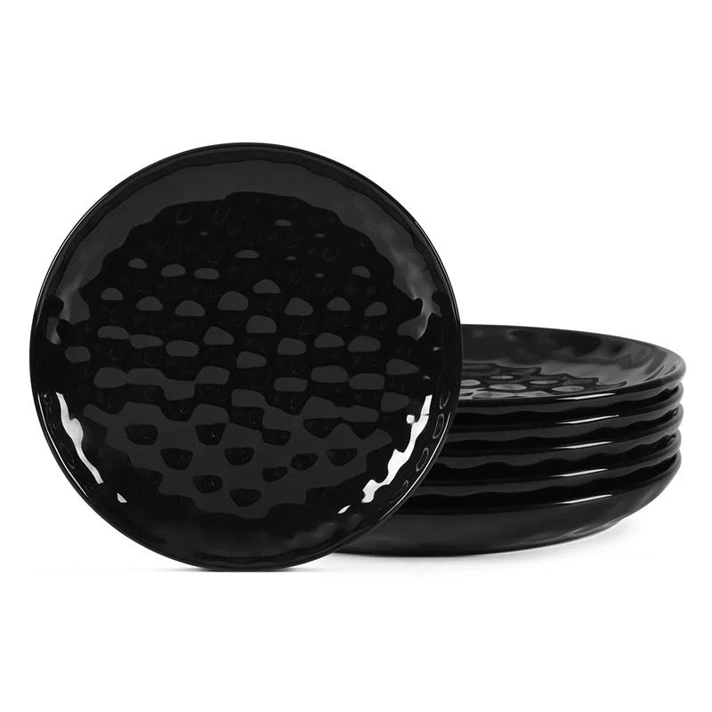 Elegant black ceramic dinner plate set with hammered design, perfect for parties and family dinners