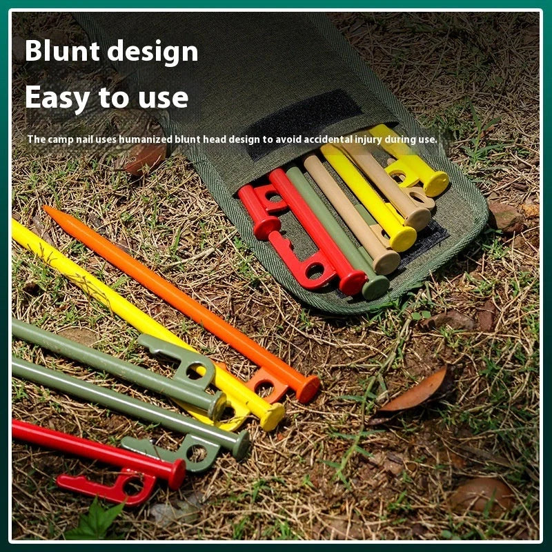 Sturdy black steel camping peg for secure tent pitching, 30cm in length