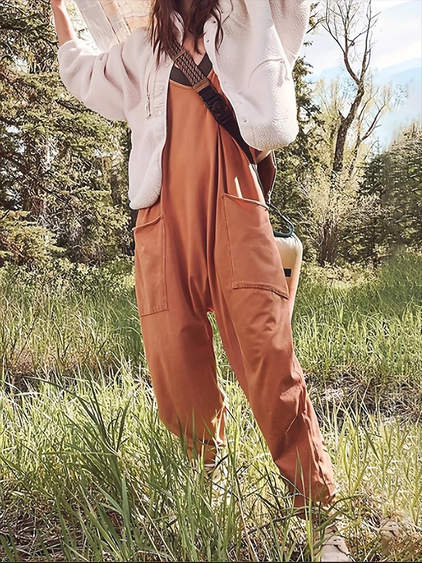 Sleeveless jumpsuits for women in a variety of colors, including black, gray, green, brown, orange-red, light blue, purple, and dark gray