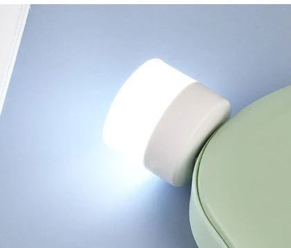 Compact USB LED night light with soft glow for reading and sleep