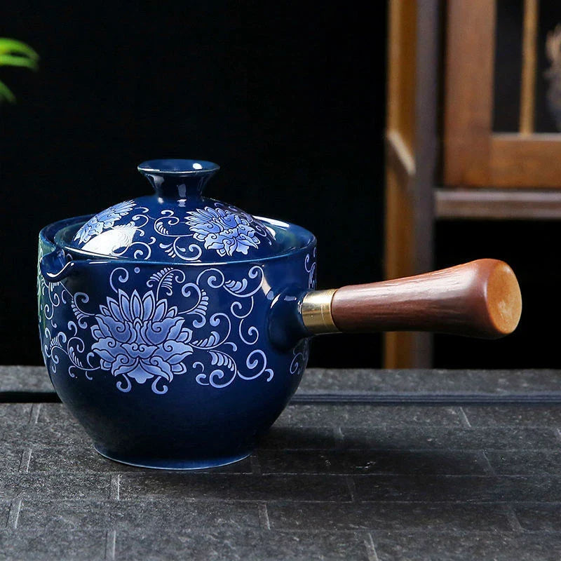 Handcrafted ceramic teapot with wooden handle, designed for brewing traditional Oolong tea with enhanced flavour and aroma