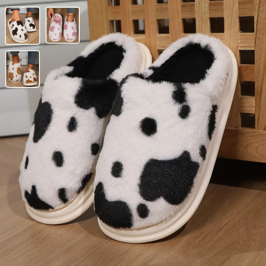 Cozy cow print plush slippers with a non-slip sole, perfect for indoor comfort and warmth