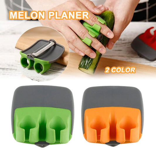 Two-finger peeler with ergonomic grip and stainless steel blade
