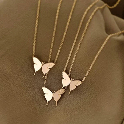 Elegant geometric butterfly pendant necklace in gold, silver, and rose gold