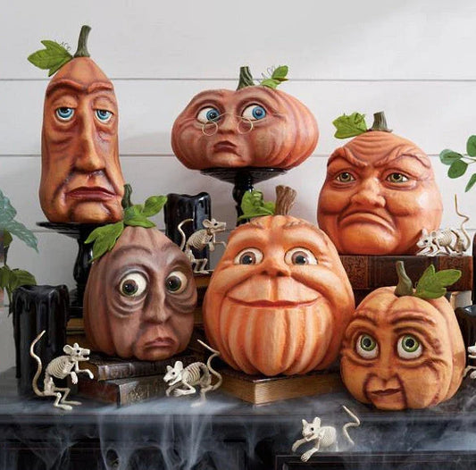 A collection of hand-crafted pumpkin decorations in various sizes, perfect for adding an enchanting touch to your Halloween celebrations.