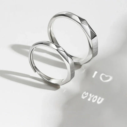 Stylish sterling silver rings with a hidden love pattern design, perfect for romantic gifts or personal accessorizing.