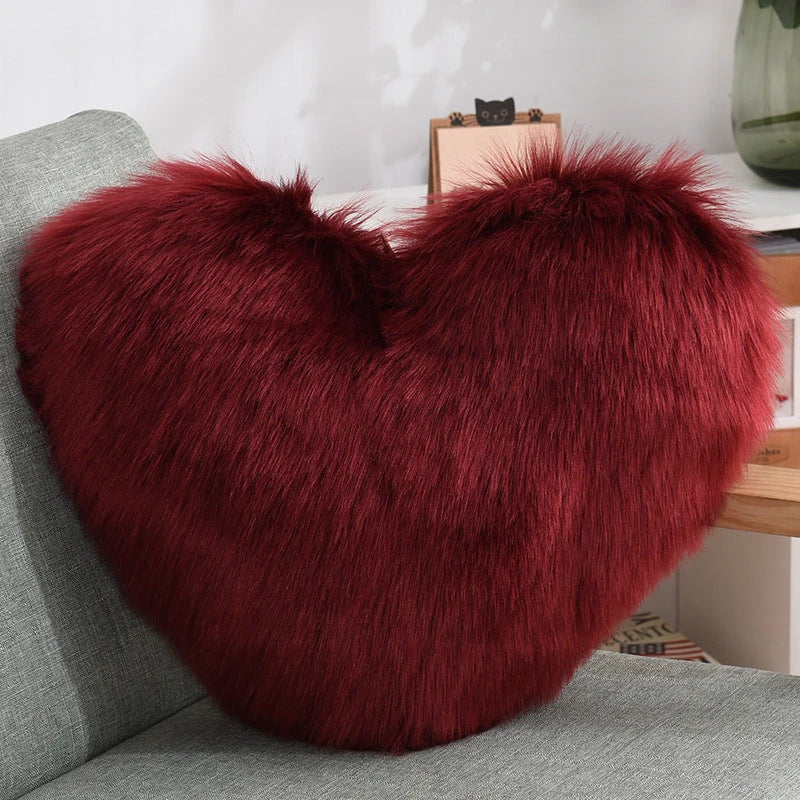 Cozy heart-shaped throw pillow with plush, shaggy texture in various colors