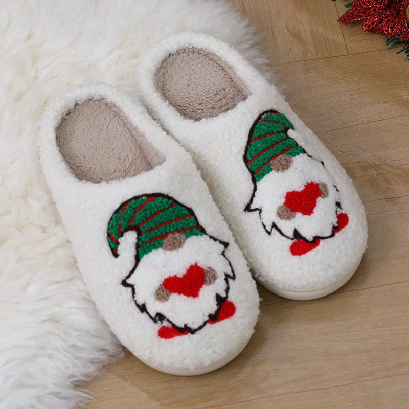 Cozy Christmas-themed slip-on slippers with a charming Santa Claus design, perfect for indoor comfort and warmth during the holiday season.