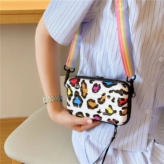 Fashionable one-shoulder bag with geometric pattern and multiple colour options, perfect for the modern British consumer