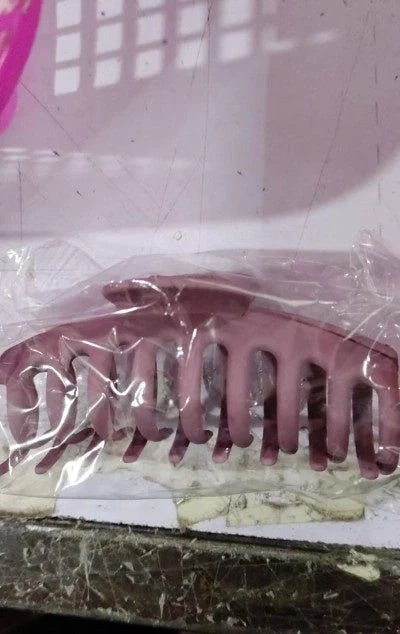 Candy-coloured plastic ponytail clip for showers and daily hair styling