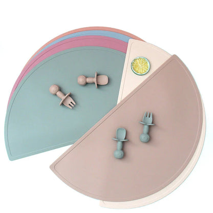 Durable silicone placemat in various colors, featuring waterproof and stain-resistant properties for easy cleaning