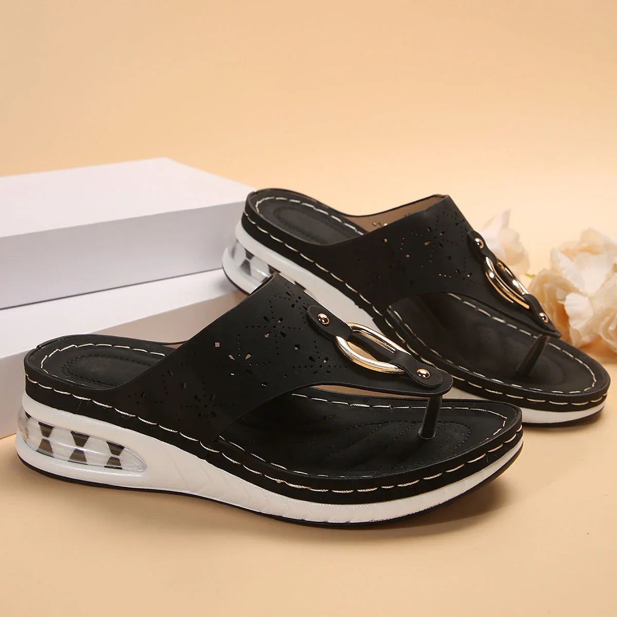 Cushioned thong sandals in various colors and sizes, featuring a unique design, air-cushioned footbed, and durable rubber sole for comfort and style.
