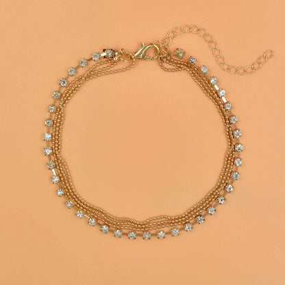 Stylish multi-layer beaded anklet necklace set with a geometric design in gold and silver tones