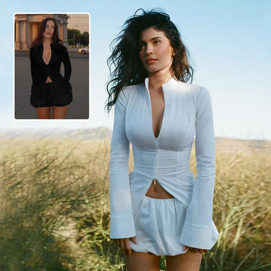 Fashionable two-piece set featuring a tailored top with V-neck and long sleeves, and a chic mini skirt. Available in white and black colours.