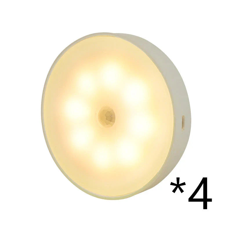 Motion-activated LED puck lights in warm and white color options, with various pack sizes and USB recharging