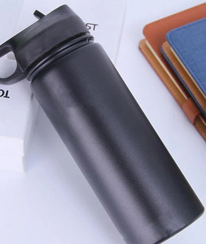 Premium stainless steel insulated tumbler with push-button lid and sleek design for outdoor adventures and active lifestyles.