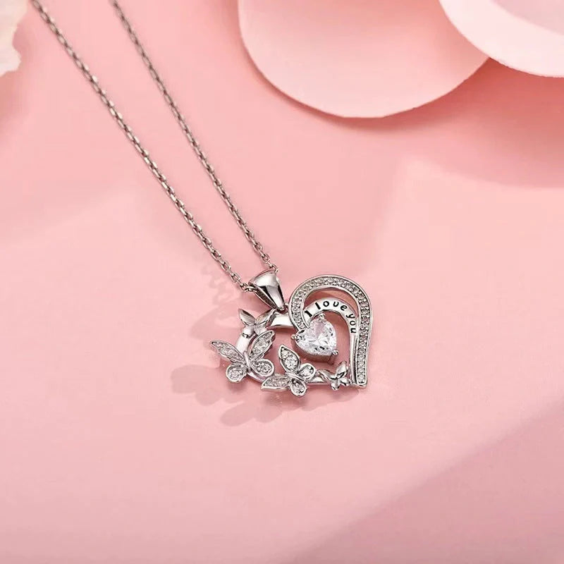 Butterfly Love Necklace with rhinestones and hollow heart-shaped pendant in white, purple, or pink