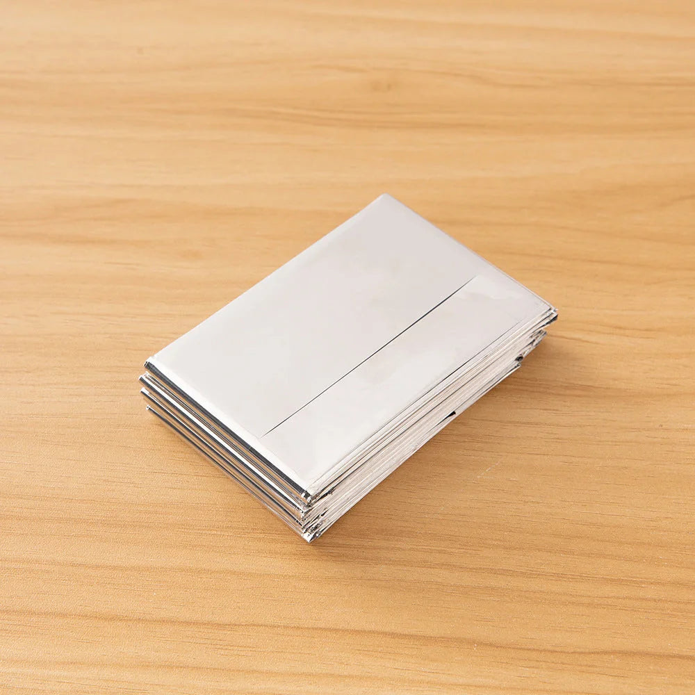 Double-sided silver and gold emergency survival blanket for outdoor use