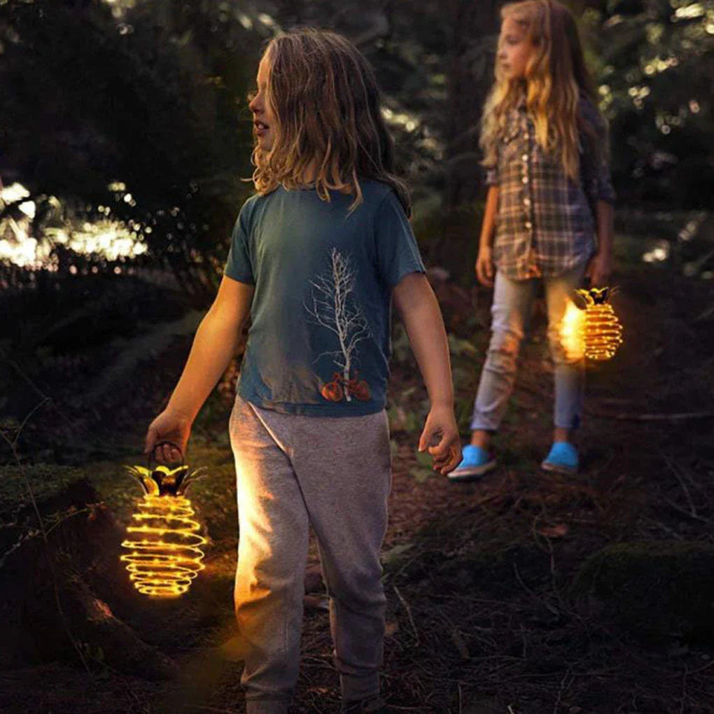 Elegant solar-powered garden lights with a whimsical pineapple design, automatically lighting up from dusk till dawn