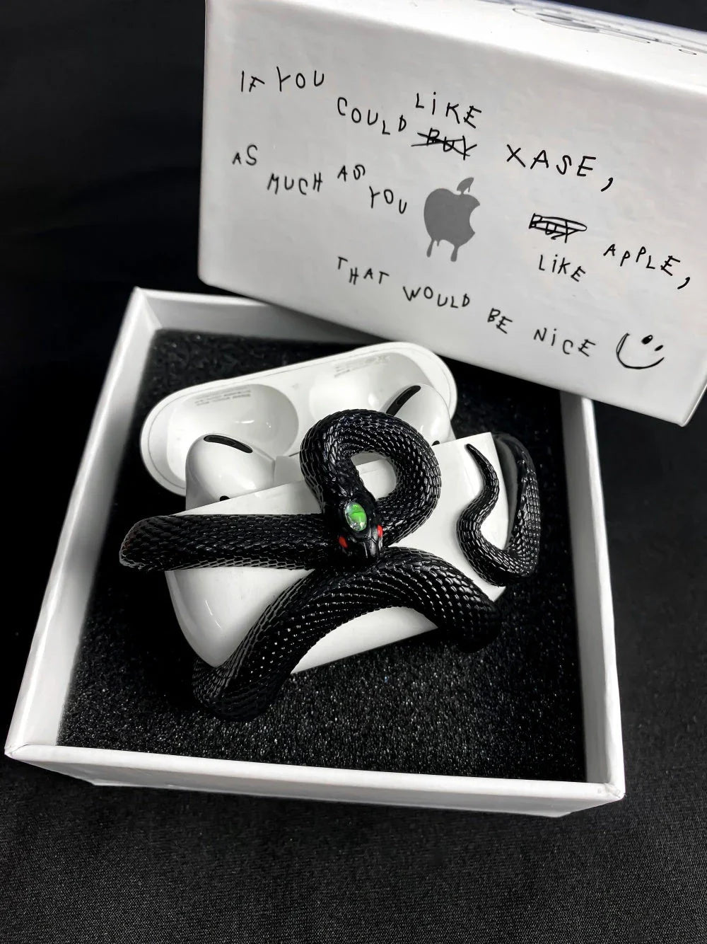 Spooky AirPods Pro case with creepy snake design, offers superior protection for wireless earphones