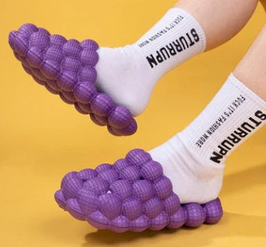 Comfortable massage bubble slides with breathable mesh upper and non-slip soles for indoor relaxation and pampering