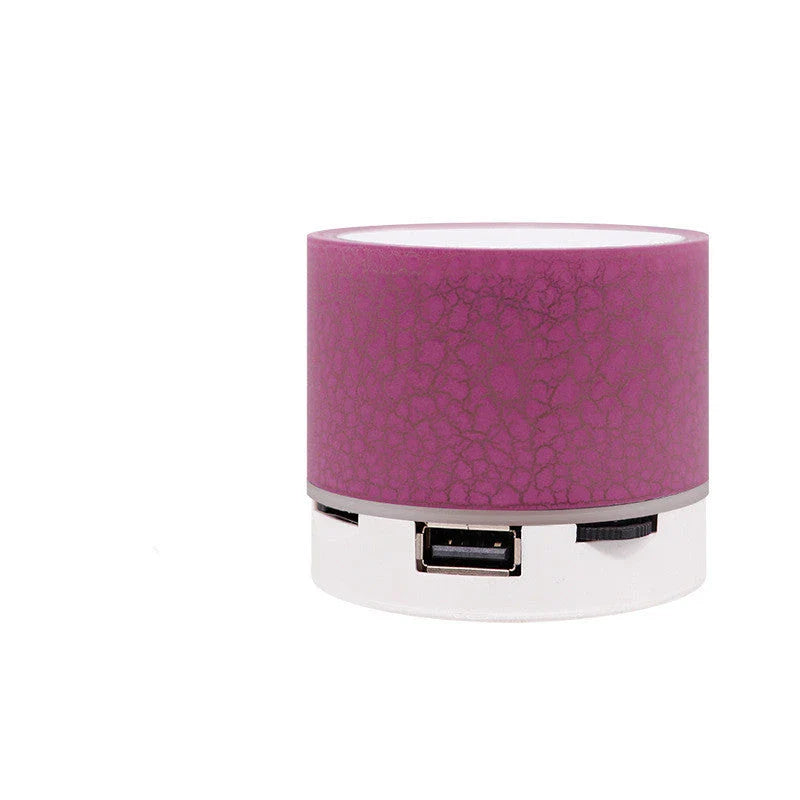 Portable Bluetooth speaker with colorful changing lights, high-quality audio, and durable design for on-the-go use