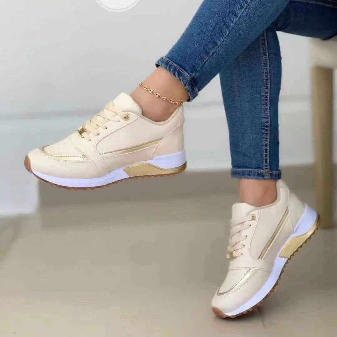 Stylish lace-up sneakers with synthetic leather upper and cushioned sole for casual comfort and versatile style.