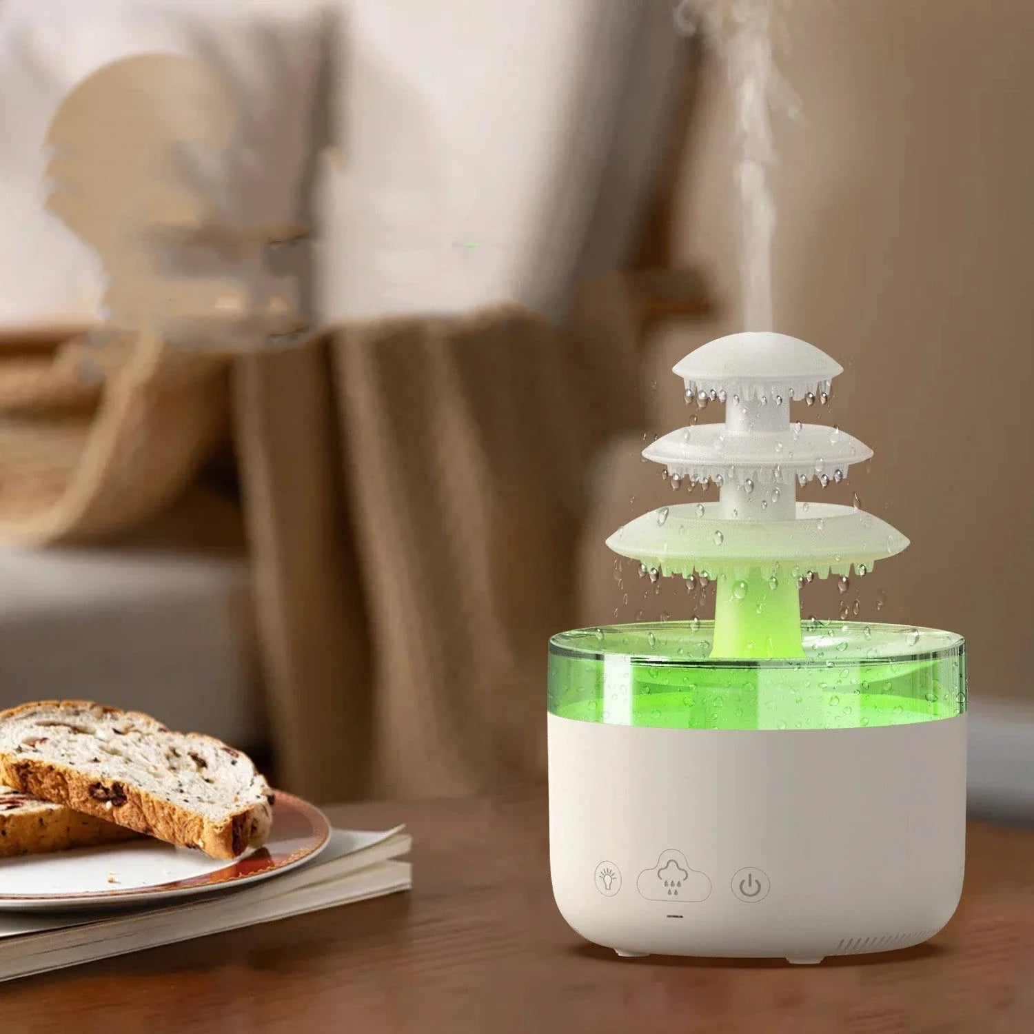 A white humidifier with a cloud-shaped design, featuring color-changing lights and essential oil diffuser capabilities.