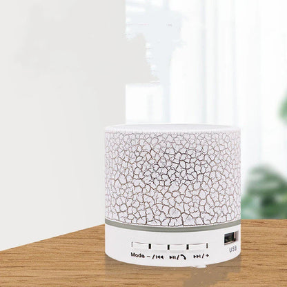 Portable Bluetooth speaker with colorful changing lights, high-quality audio, and durable design for on-the-go use