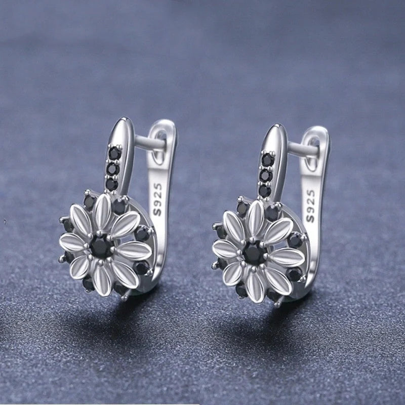 Elegant copper flower earrings with sparkling zircon accents, perfect for any occasion.