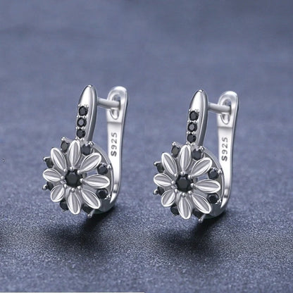 Elegant copper flower earrings with sparkling zircon accents, perfect for any occasion.
