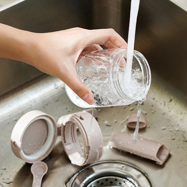 Small glass seasoning jars with lids and built-in spoons for easy measuring and storage