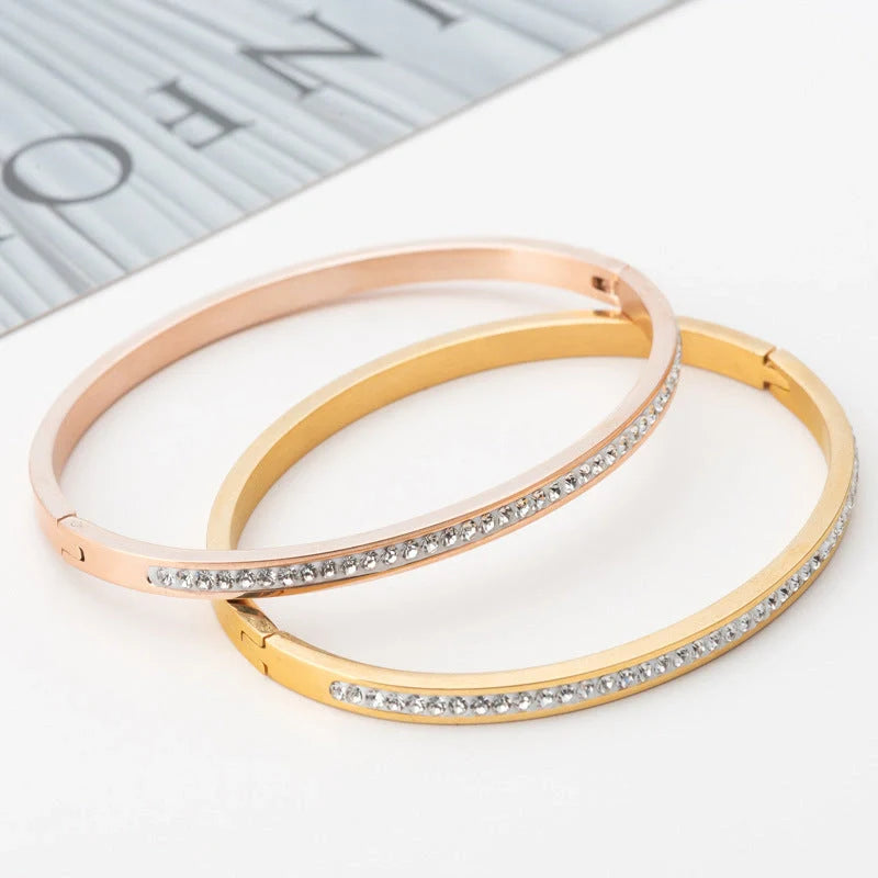 Single row stainless steel bracelet with diamond opening in gold, rose gold, or steel colour