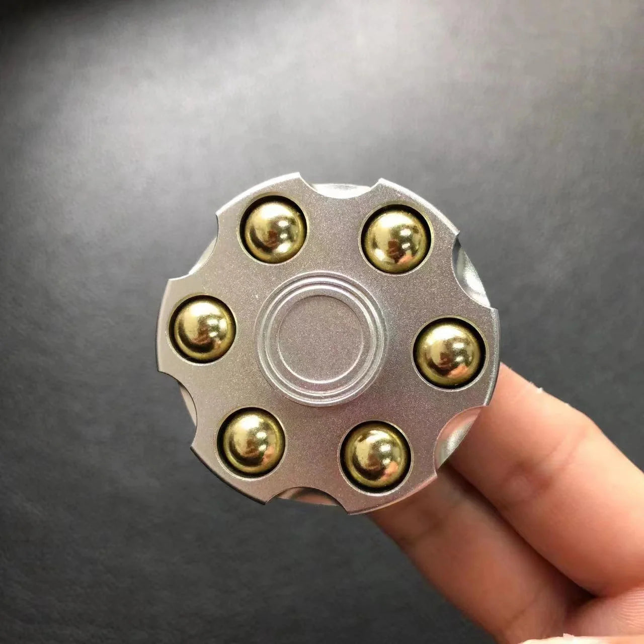 Brass gun revolver bullet fidget toy spinner with detachable rotating feature