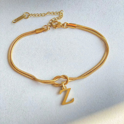 Personalised gold and silver love knot bracelets for couples, perfect as Valentine's Day gifts.