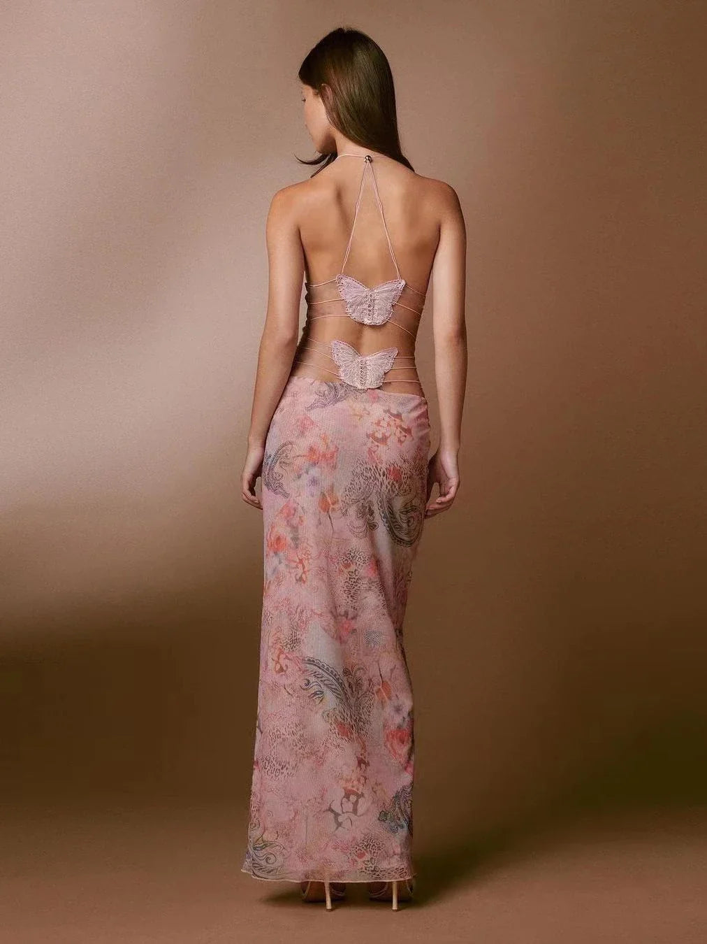 Stylish floral halter dress with spaghetti straps and butterfly back design, available in various vibrant colors