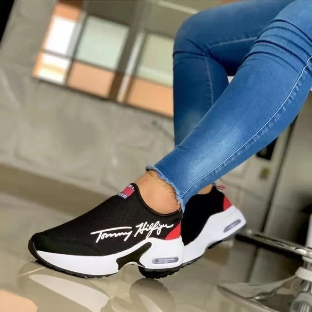 Women's Air Cushion Slip-on Sneakers in white, red, black, and navy blue