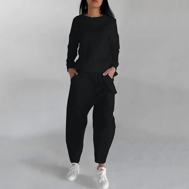 Stylish polyester sweatshirt with back slit, pockets, and available in various colors