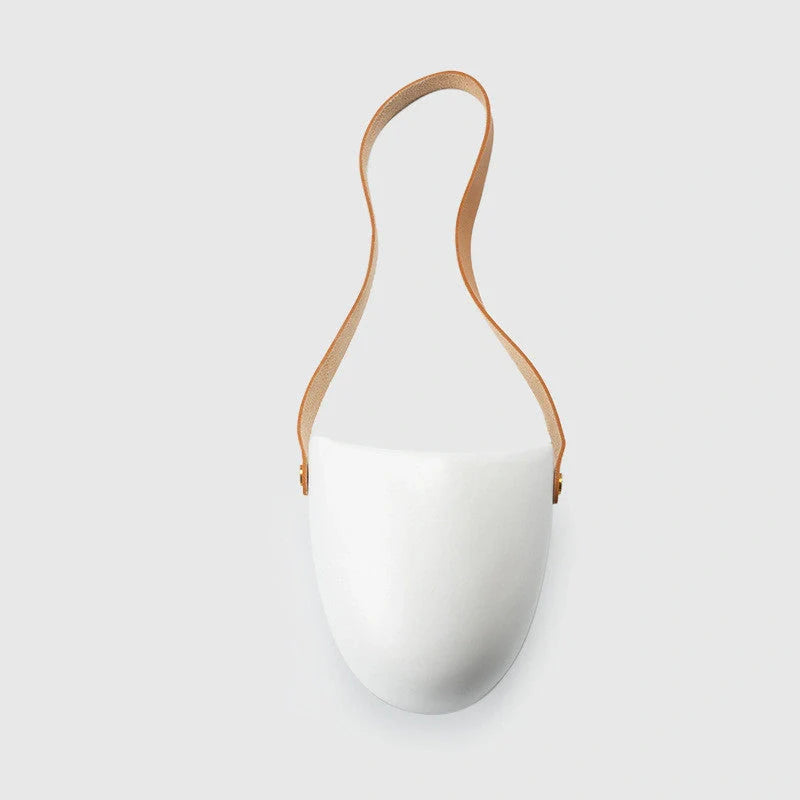 Wall-mounted ceramic flower pot in matte white with hemp rope for balcony gardening