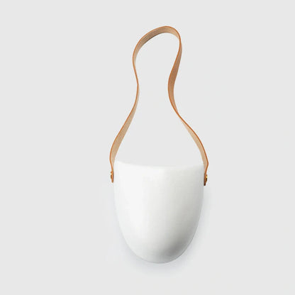Wall-mounted ceramic flower pot in matte white with hemp rope for balcony gardening