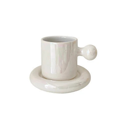 Elegant porcelain egg cup and saucer set in various colors, including white, yellow, orange, and green