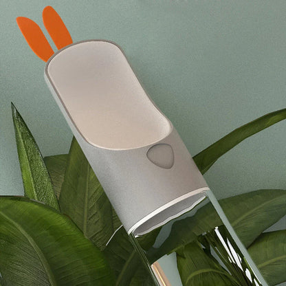 Portable pet water feeder with carbon filter, leak-proof design, and hands-free strap for outdoor hydration