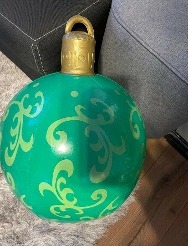 Vibrant inflatable Christmas baubles in a variety of colours and patterns, perfect for outdoor holiday decoration