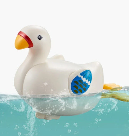 Charming wind-up bath toys featuring a goose and dolphin design, made of durable ABS plastic for safe and fun water play
