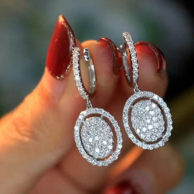 Elegant white gold plated oval earrings for women, perfect for any occasion.